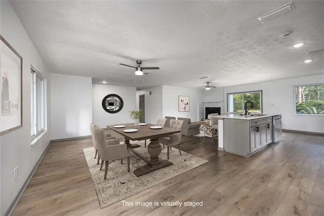 a kitchen with stainless steel appliances a sink stove and refrigerator