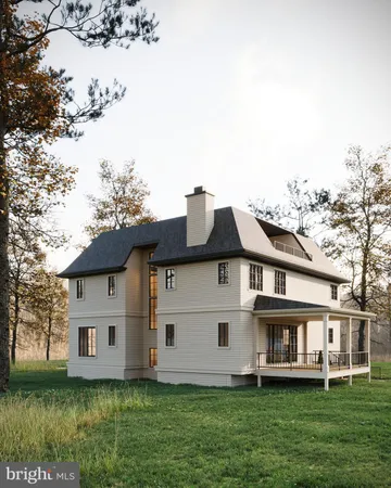 a front view of a house with a garden and trees