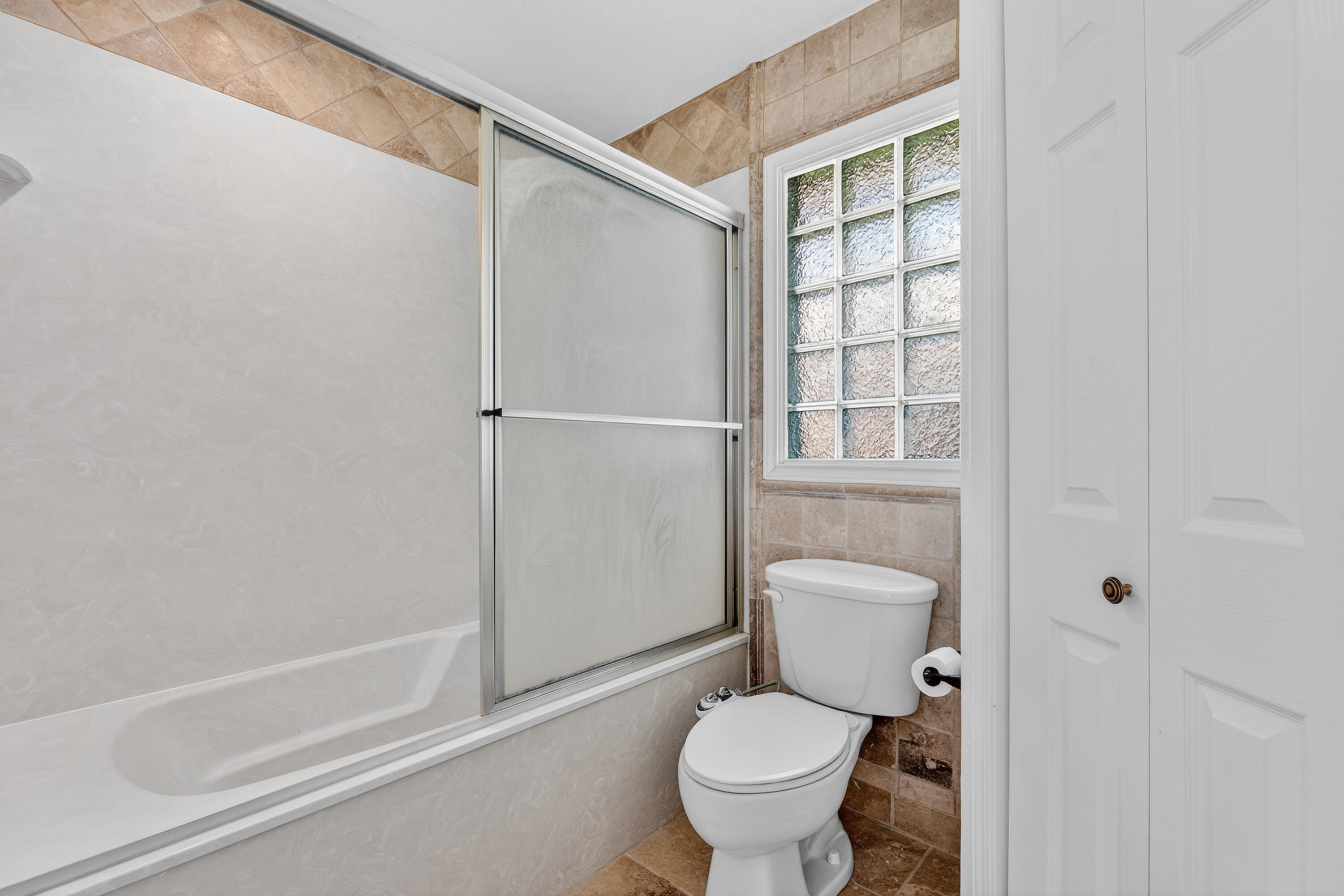 4616 9th Street Lubbock, TX 79416 - Photo 42 of 53 a bathroom with a toilet and a shower