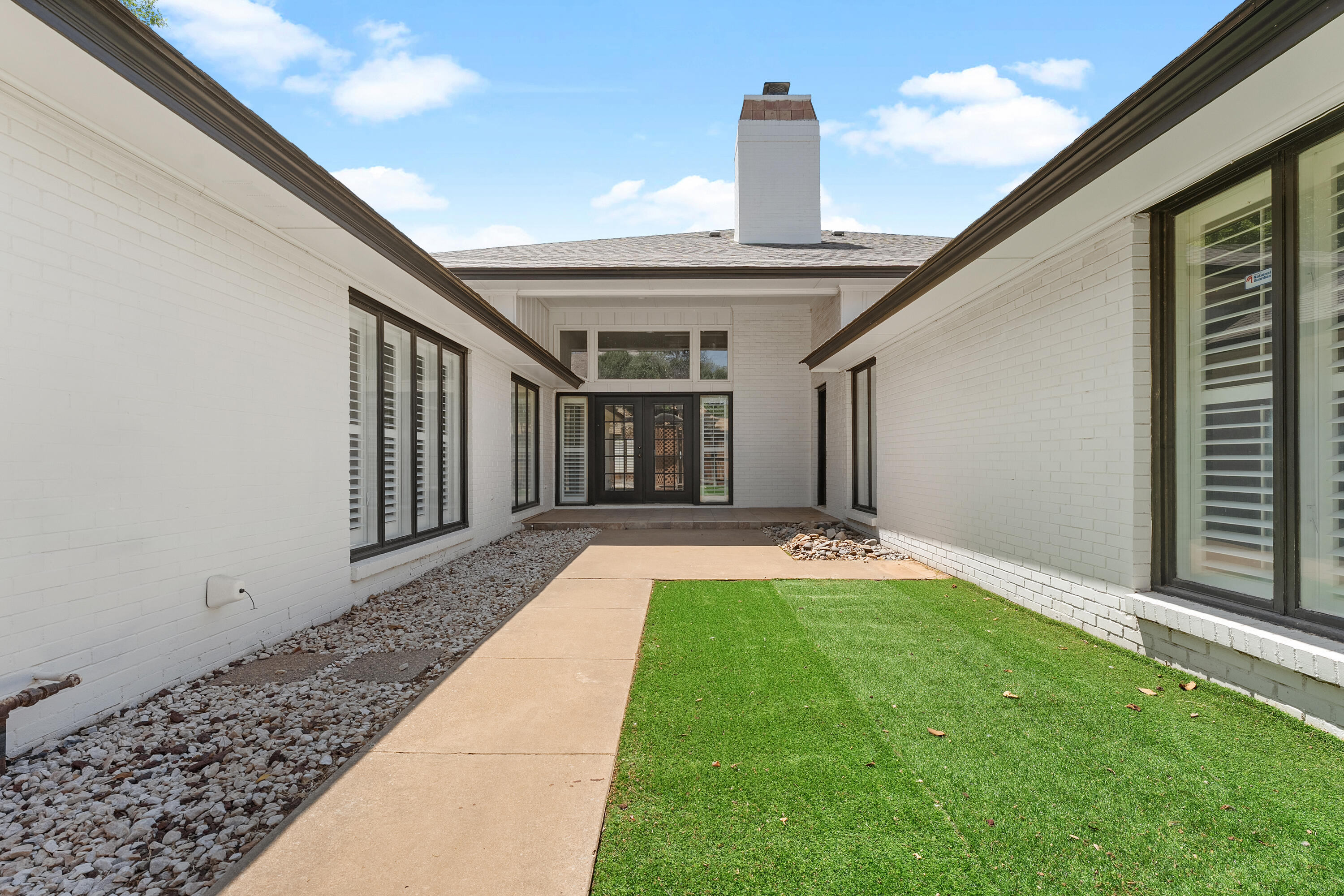 4616 9th Street Lubbock, TX 79416 - Photo 46 of 53 a front view of a house with yard