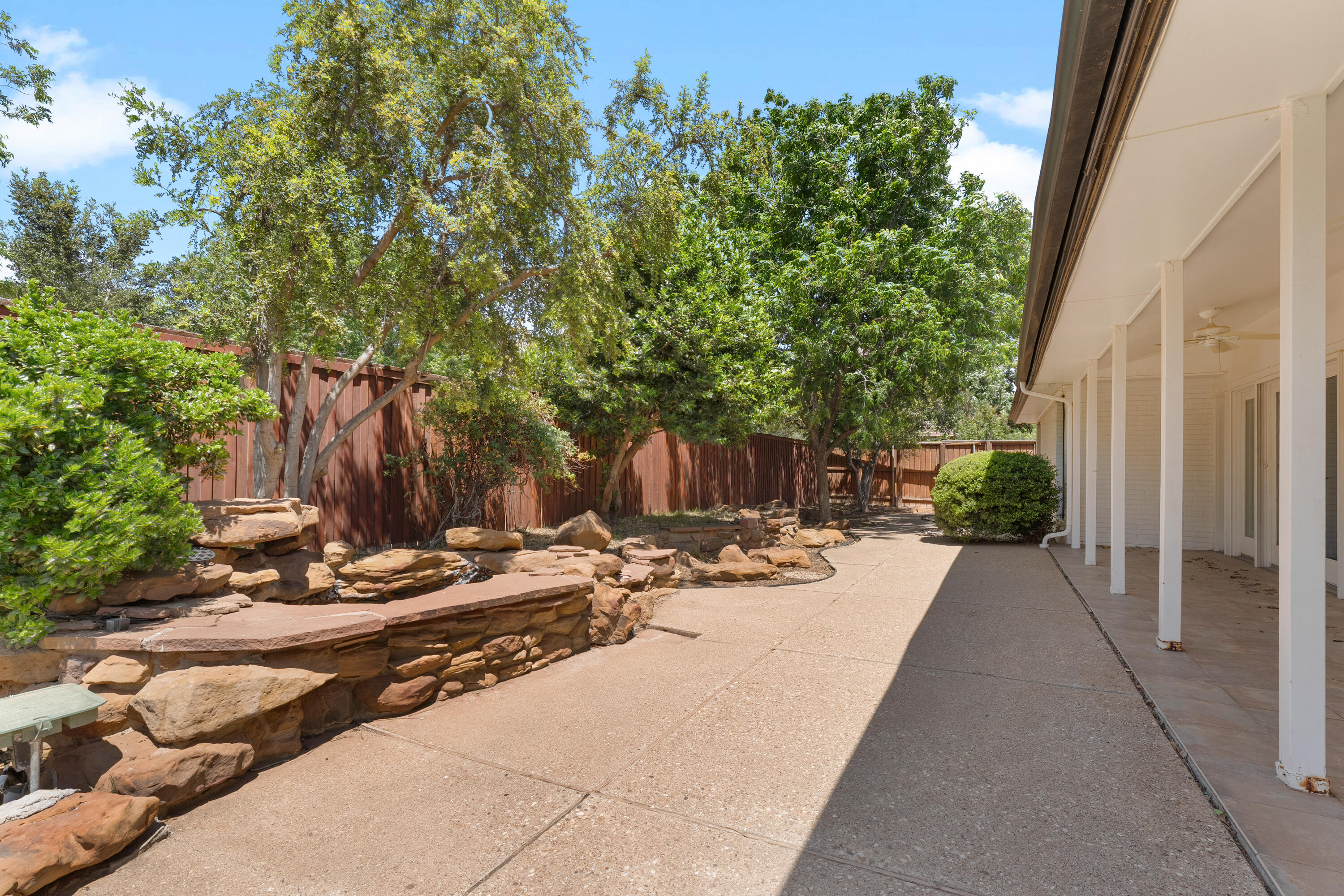 4616 9th Street Lubbock, TX 79416 - Photo 51 of 53 a view of a backyard with tree