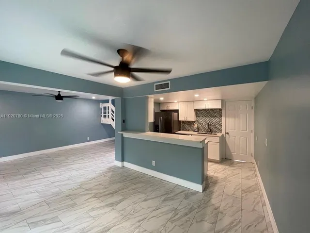 a view of a kitchen and a sink