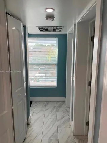 a view of an empty room and window