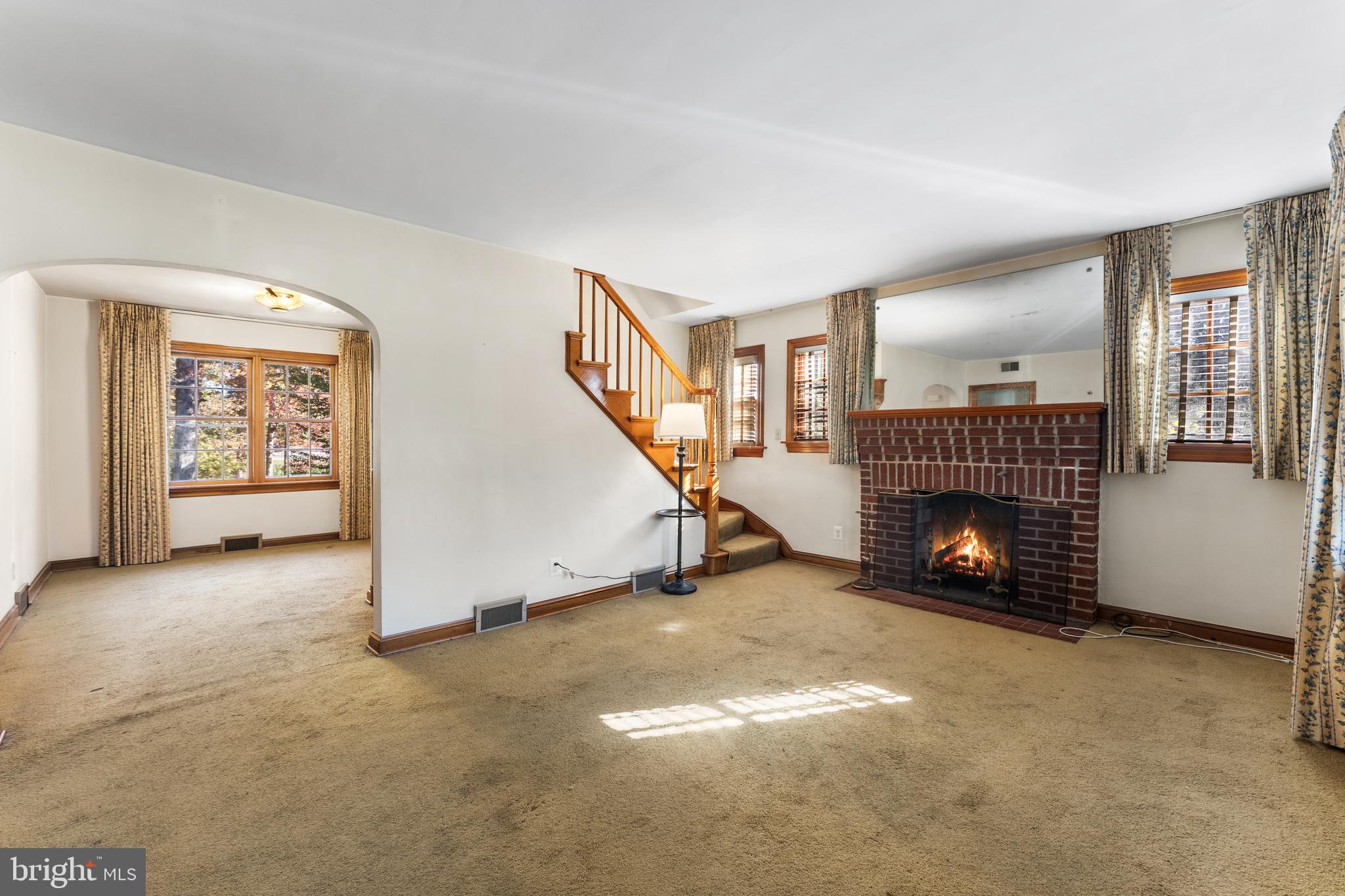 12606 Sub-Station Road Waldorf, MD 20601 - Photo 12 of 44 an empty room with windows fireplace and windows