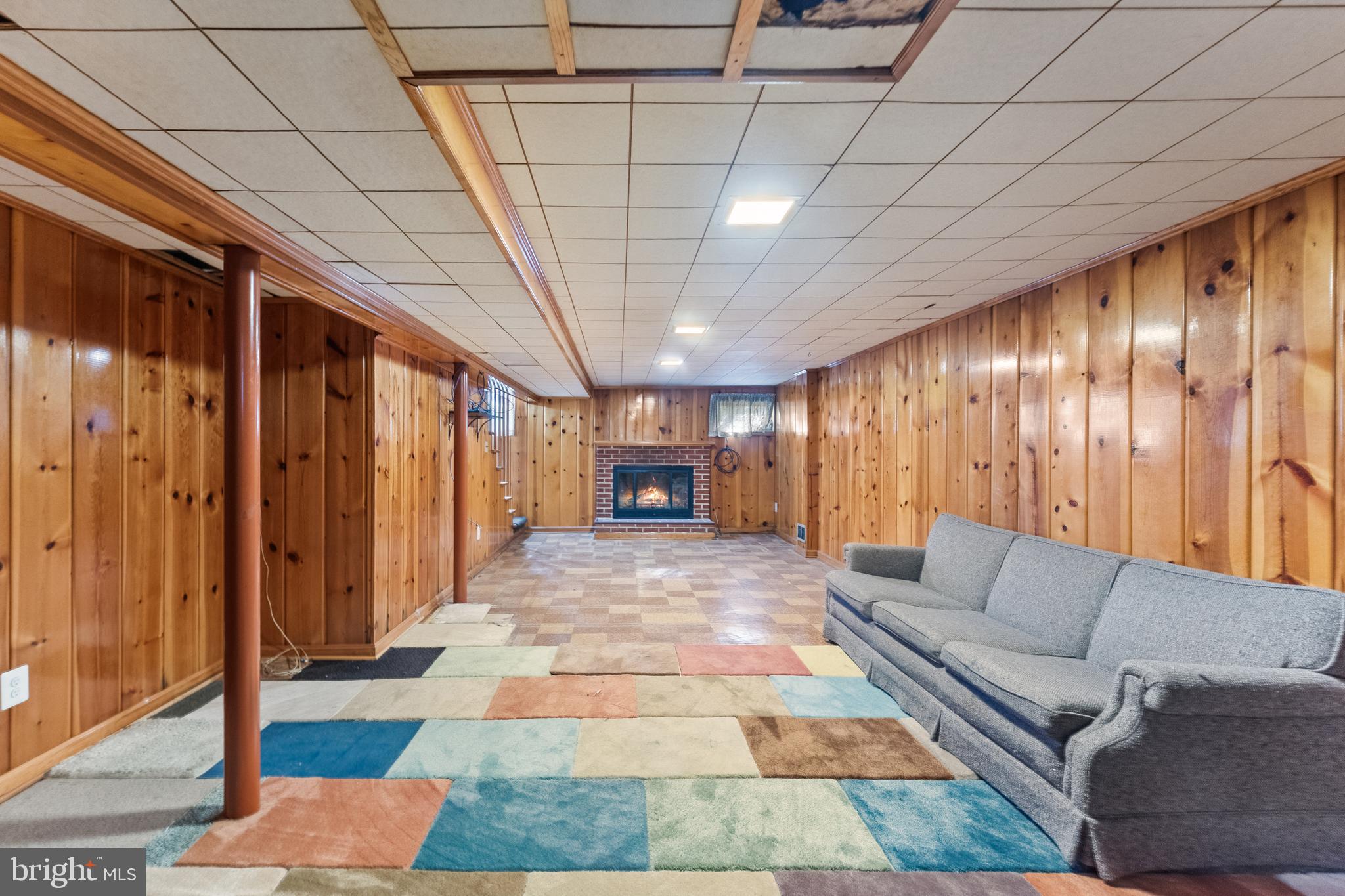 12606 Sub-Station Road Waldorf, MD 20601 - Photo 35 of 44 a living room with furniture and a chandelier