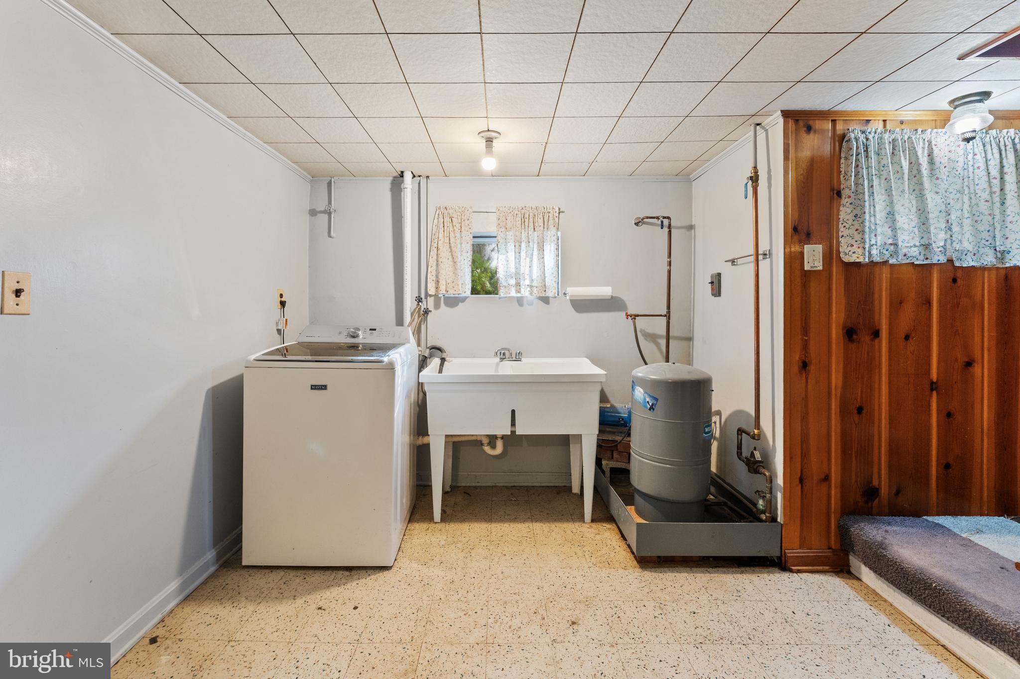 12606 Sub-Station Road Waldorf, MD 20601 - Photo 36 of 44 a room with furniture and a chandelier