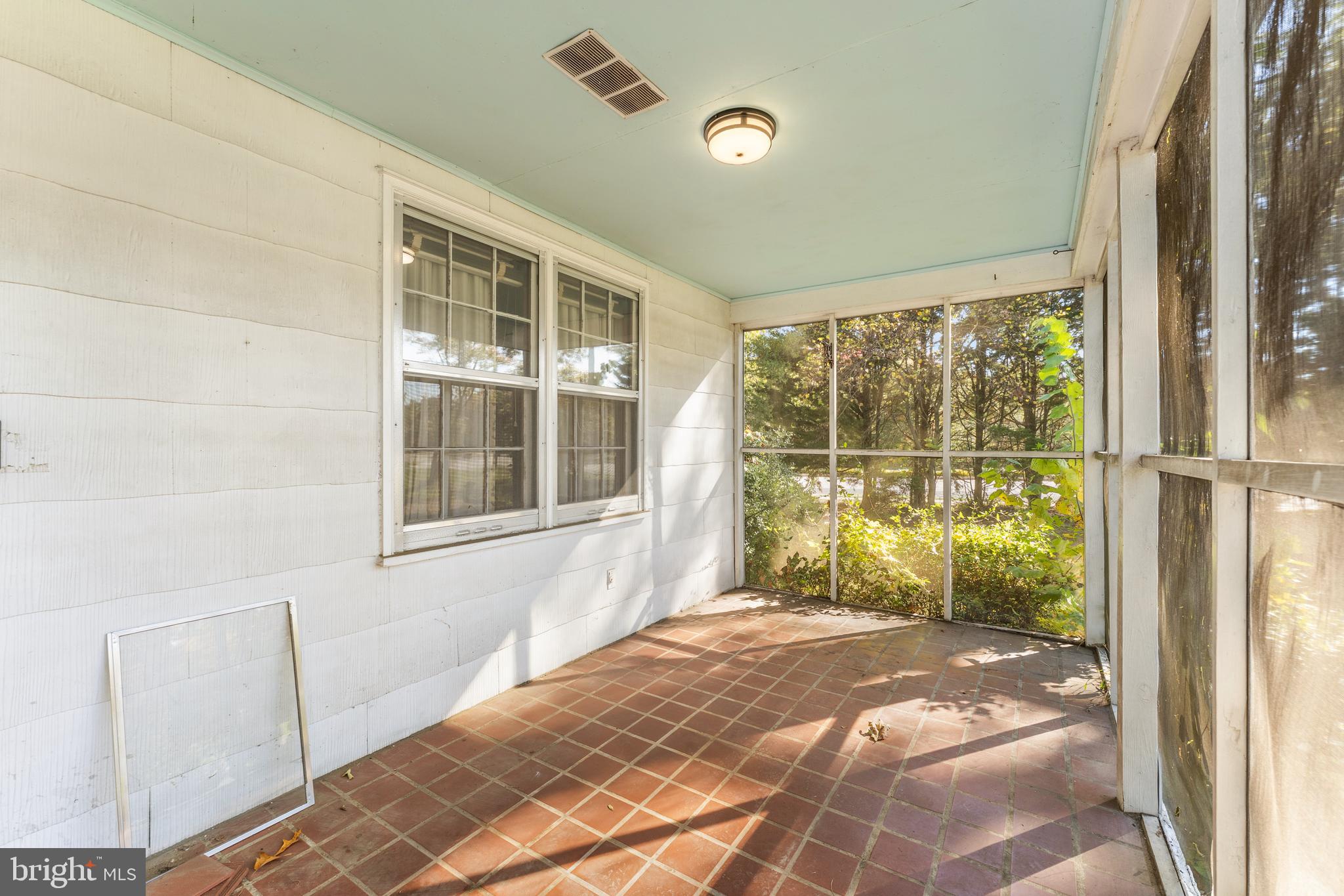 12606 Sub-Station Road Waldorf, MD 20601 - Photo 6 of 44 a view of a porch with a backyard