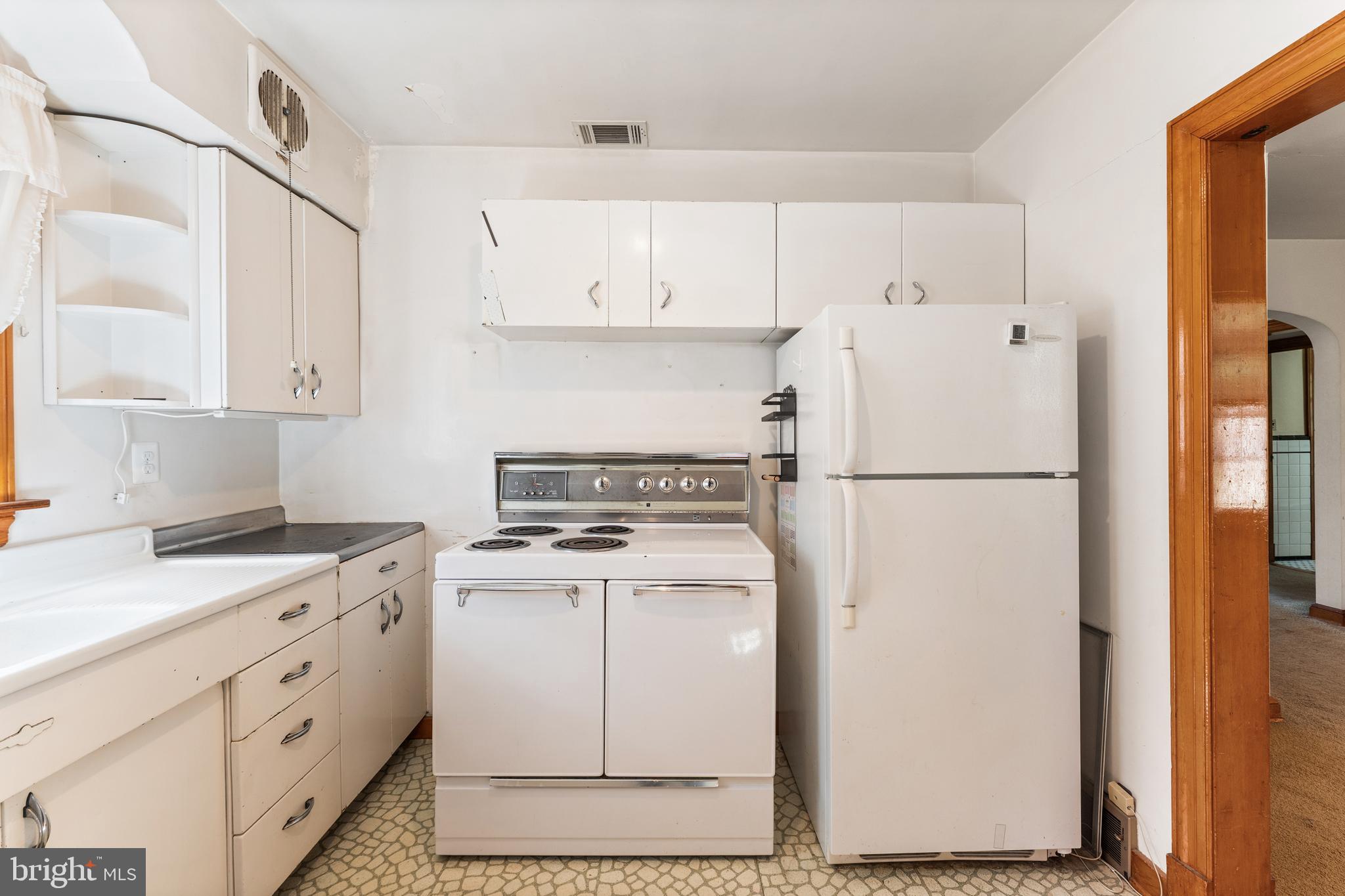 12606 Sub-Station Road Waldorf, MD 20601 - Photo 9 of 44 a kitchen with cabinets appliances and a counter space