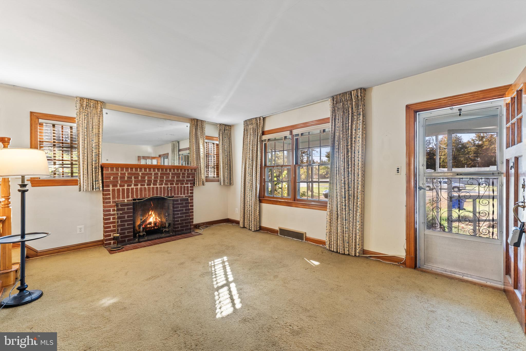 12606 Sub-Station Road Waldorf, MD 20601 - Photo 10 of 44 a view of an empty room with fireplace and a window