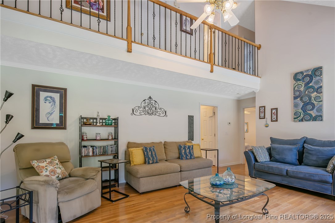 6528 Foxberry Road Fayetteville, NC 28314 - Photo 13 of 50 a living room with furniture a rug and a couch
