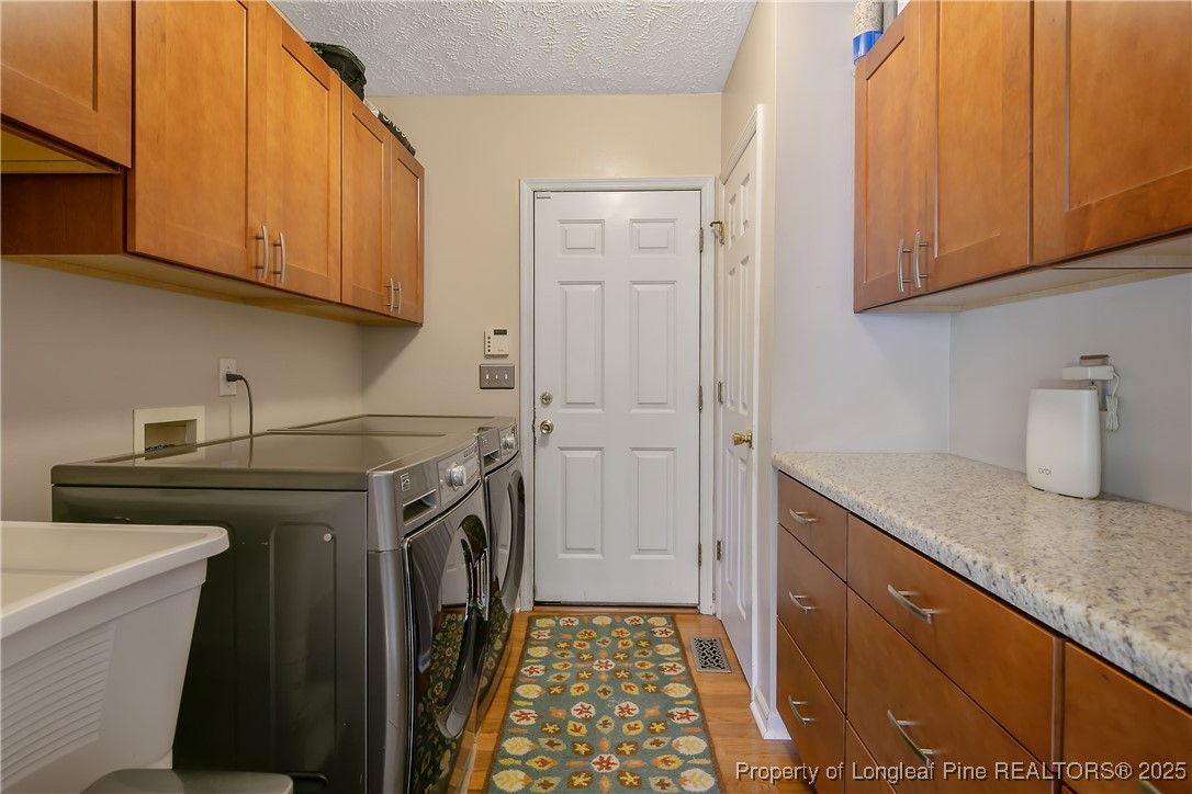 6528 Foxberry Road Fayetteville, NC 28314 - Photo 16 of 50 a kitchen with a sink stove and cabinets
