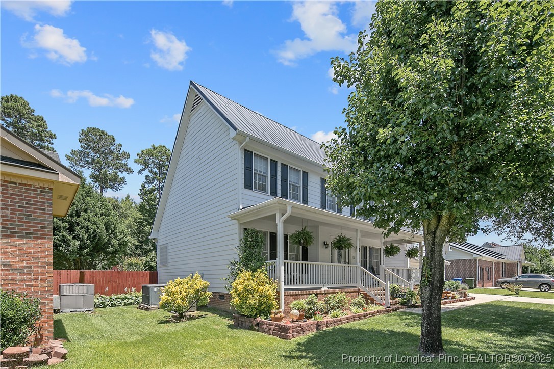 6528 Foxberry Road Fayetteville, NC 28314 - Photo 3 of 50 a front view of a house with a yard