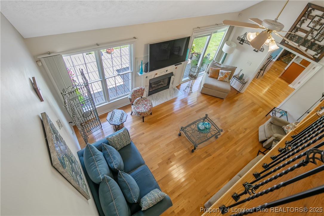 6528 Foxberry Road Fayetteville, NC 28314 - Photo 32 of 50 a living room with furniture and a flat screen tv
