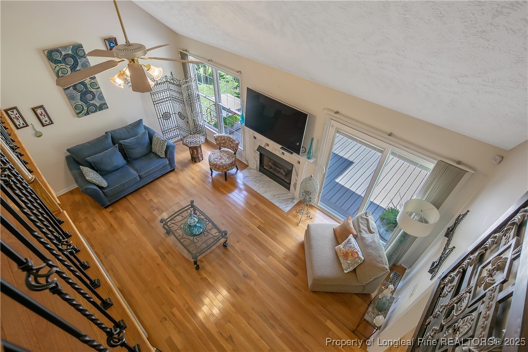 6528 Foxberry Road Fayetteville, NC 28314 - Photo 33 of 50 a living room with furniture and a flat screen tv