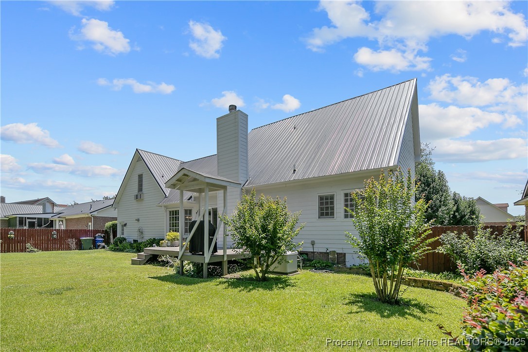 6528 Foxberry Road Fayetteville, NC 28314 - Photo 46 of 50 a view of a house with backyard garden and plants