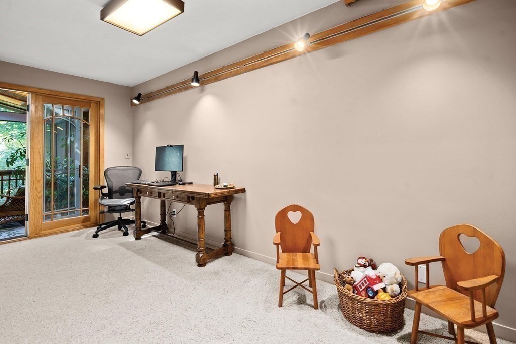 26 Valley Spring Road Newton, MA 02458 - Photo 13 of 24 a view of a workspace with furniture and a window