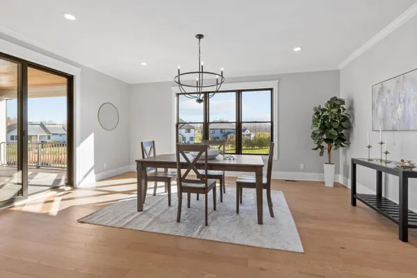 an empty room with closet and windows