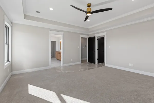 a view of workspace with window and ceiling fan