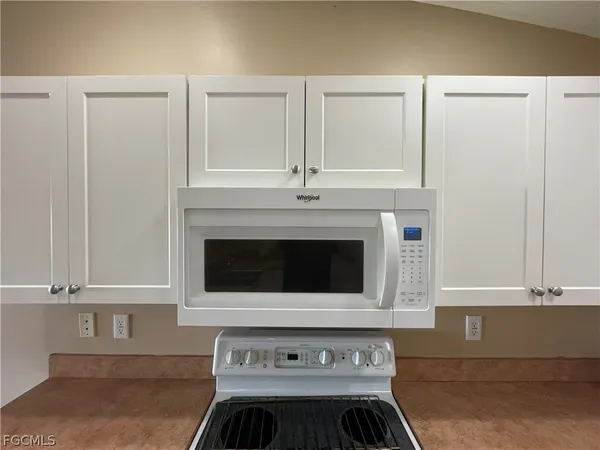 a kitchen with a sink and a window