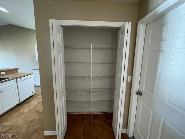 a kitchen with a sink cabinets and stainless steel appliances