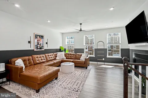 a living room with fireplace furniture and a flat screen tv