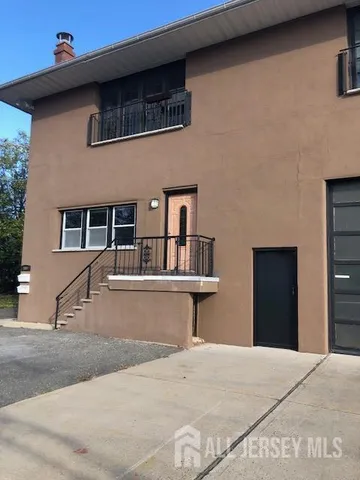 a view of a house with large windows