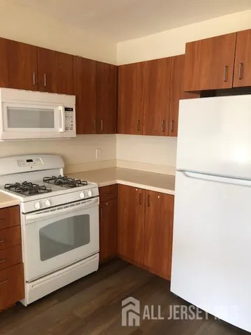 a kitchen with a sink and a refrigerator