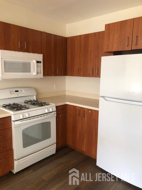 100 Albert Avenue Edison, NJ 08837 - Photo 12 of 14 a kitchen with a sink and a refrigerator