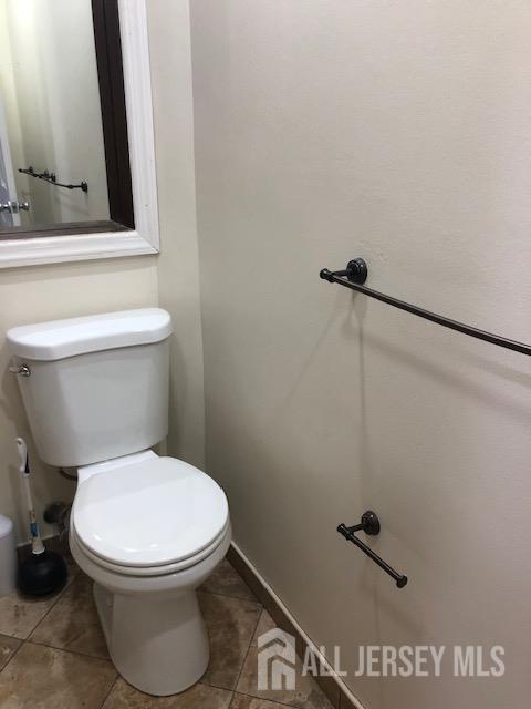 100 Albert Avenue Edison, NJ 08837 - Photo 6 of 14 a white toilet sitting next to a bathroom sink