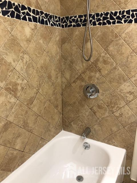 100 Albert Avenue Edison, NJ 08837 - Photo 7 of 14 a bathroom with a shower
