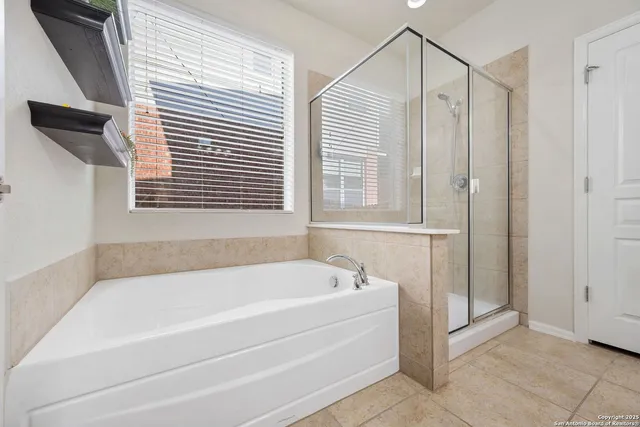 a white bath tub sitting next to a window