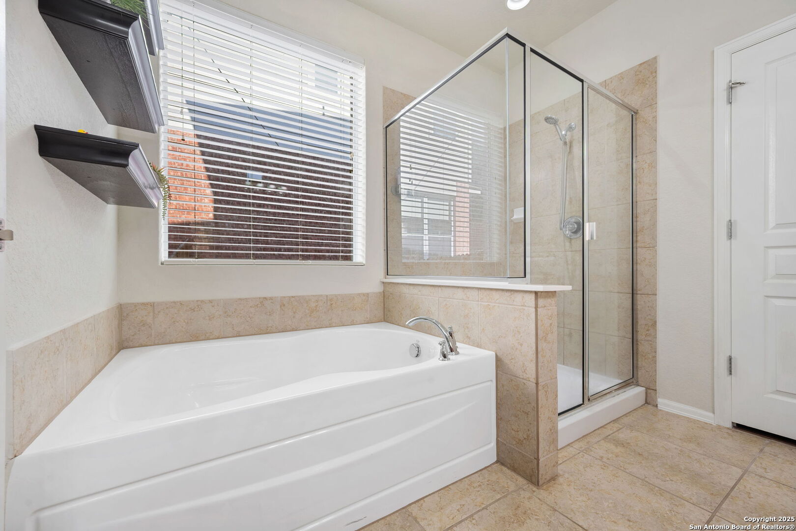 8206 Setting Moon San Antonio, TX 78255 - Photo 11 of 36 a white bath tub sitting next to a window