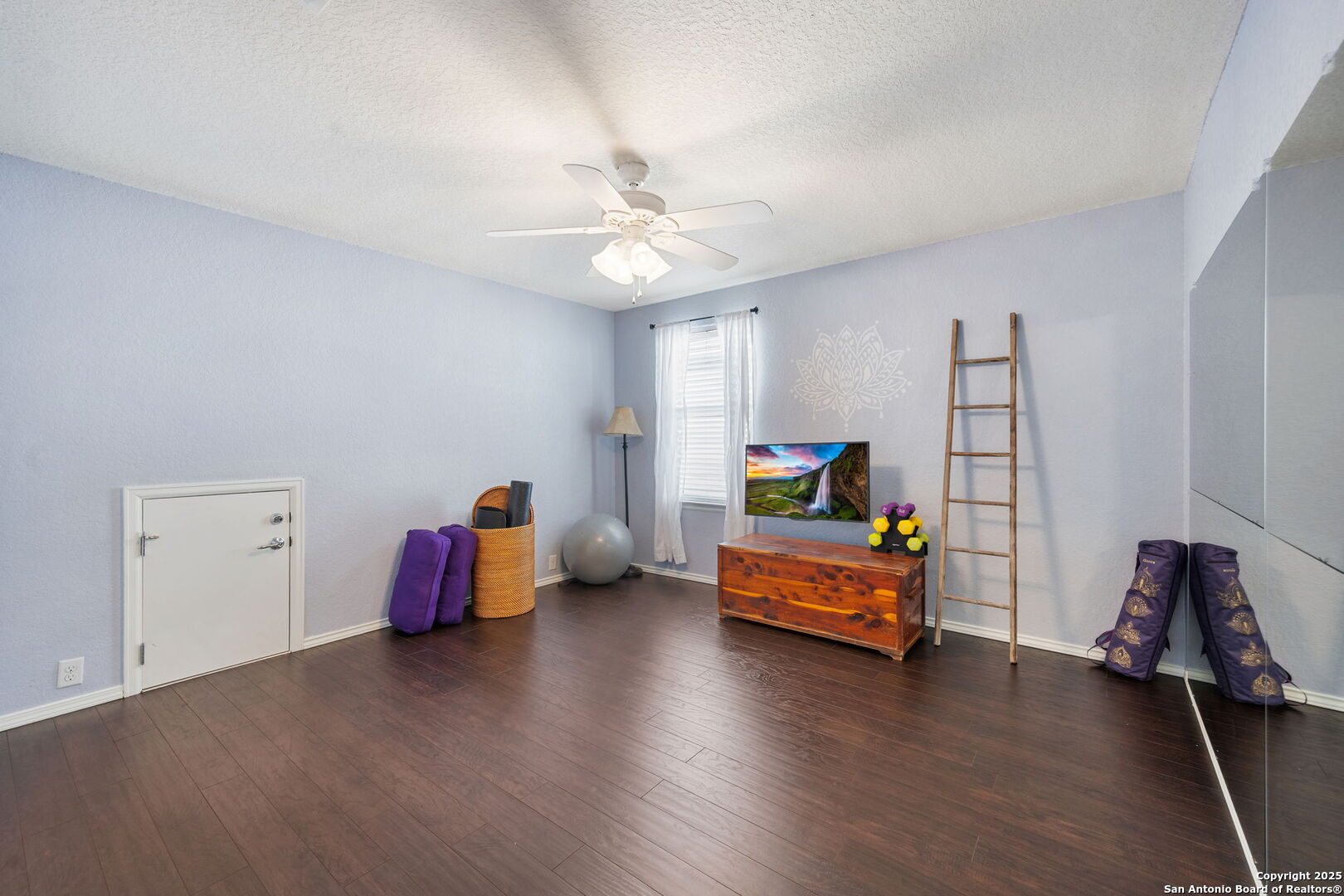 8206 Setting Moon San Antonio, TX 78255 - Photo 14 of 36 a bedroom with furniture and a wooden floor