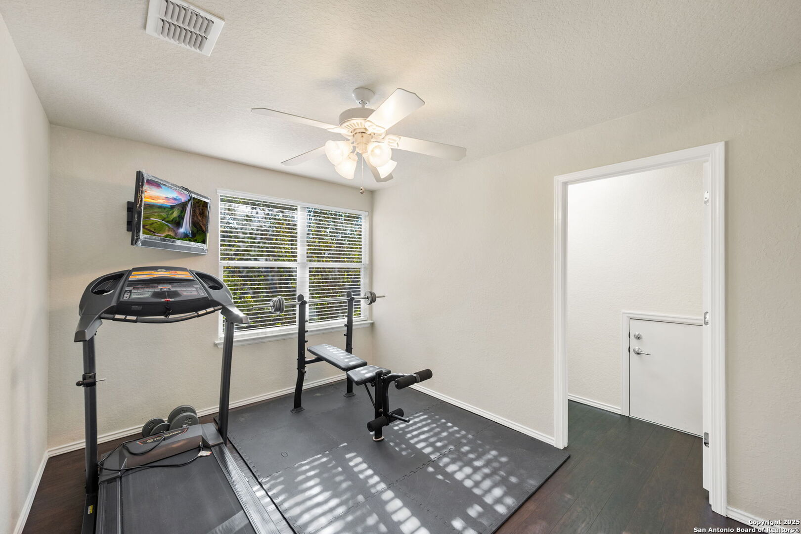 8206 Setting Moon San Antonio, TX 78255 - Photo 15 of 36 a view of a workspace with furniture and a window