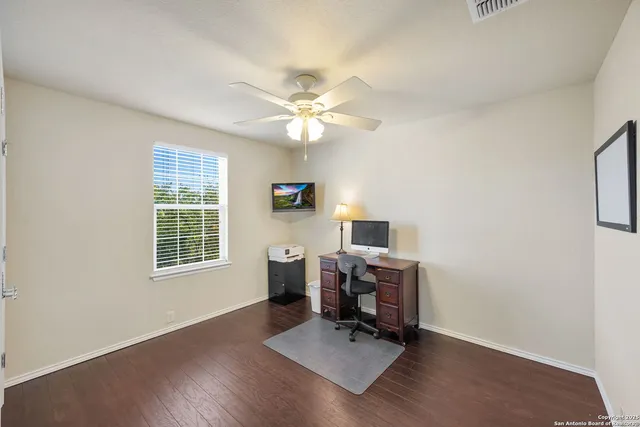 a workspace with furniture hardwood and a window