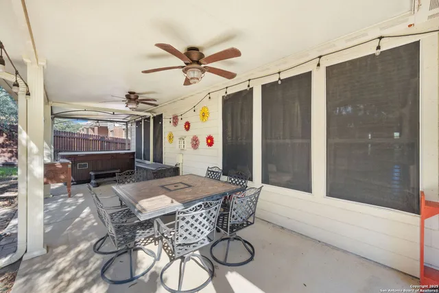 a dining room with furniture and window