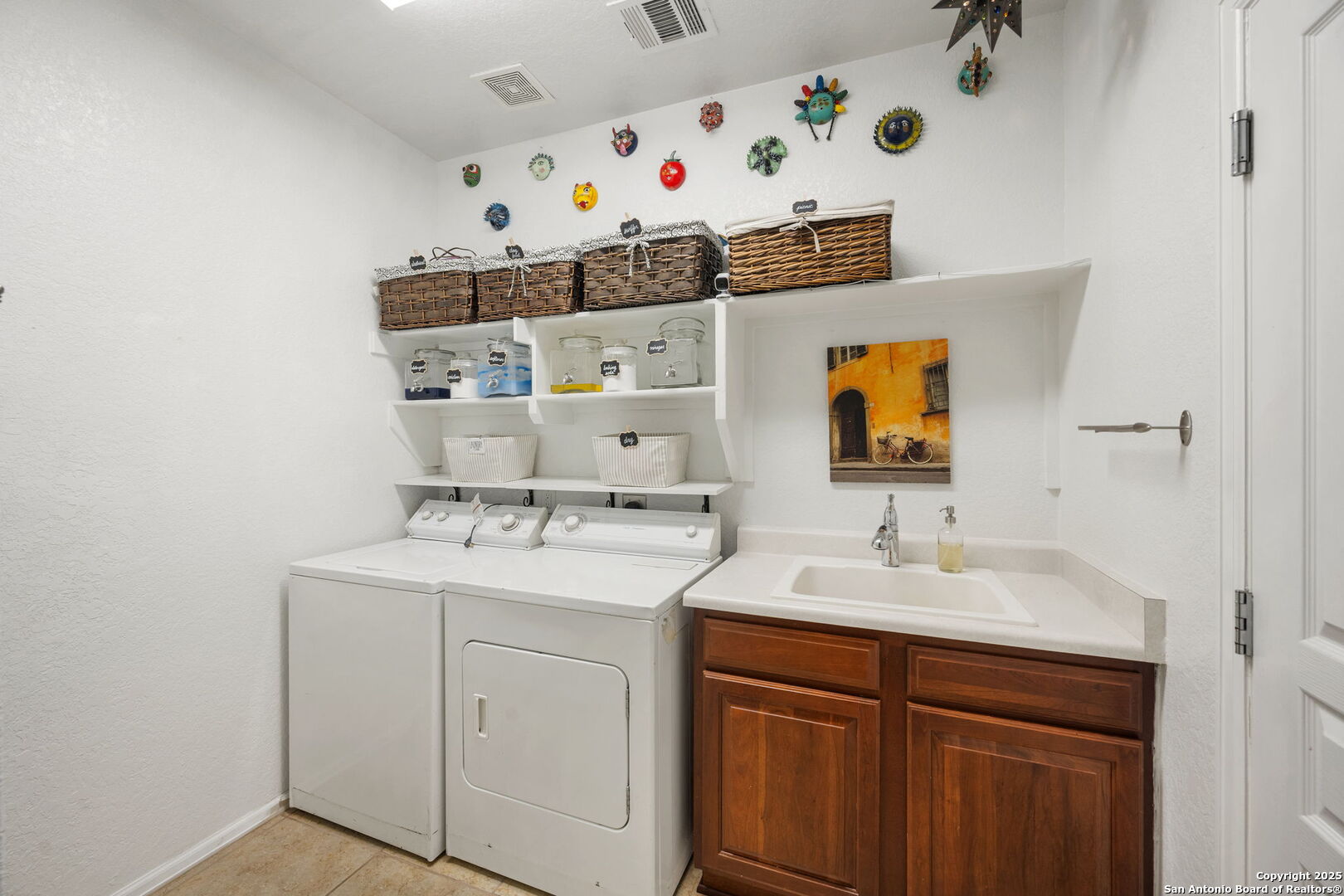 8206 Setting Moon San Antonio, TX 78255 - Photo 33 of 36 a bathroom with a sink vanity and mirror