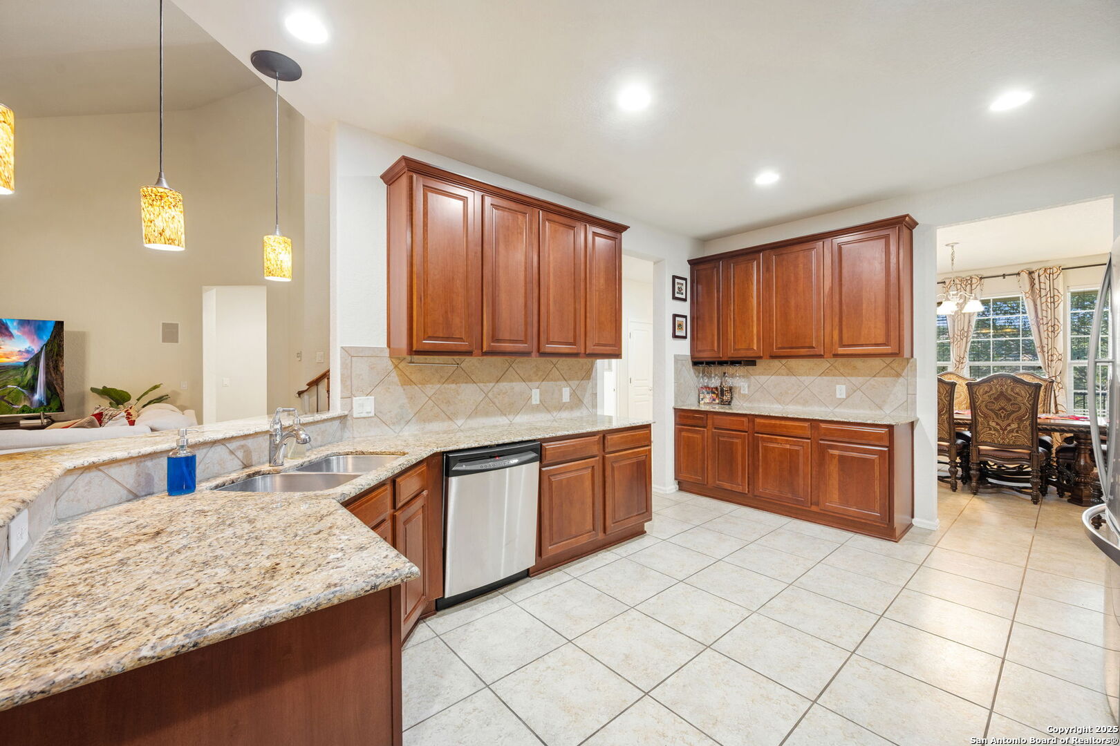 8206 Setting Moon San Antonio, TX 78255 - Photo 6 of 36 a kitchen with stainless steel appliances granite countertop a stove sink and cabinets