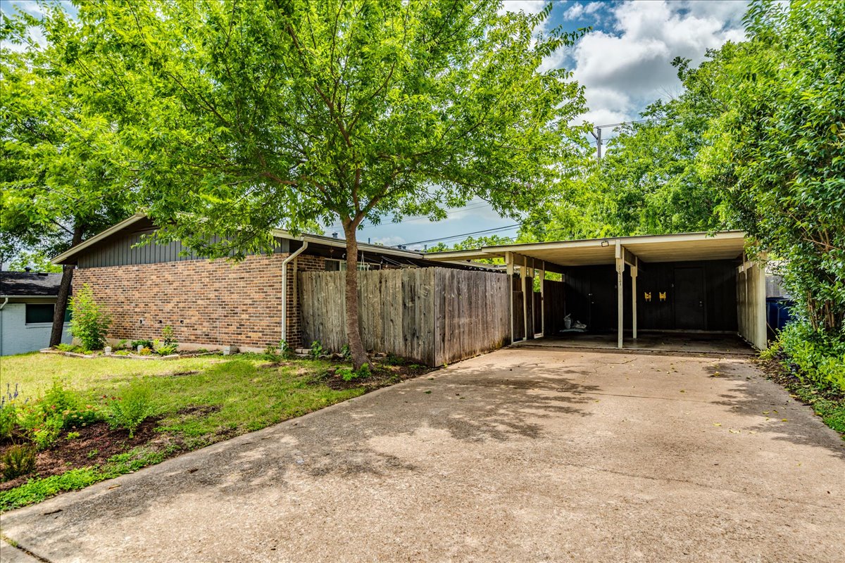 1417 Braes Ridge Drive, Unit B Austin, TX 78723 - Photo 1 of 22 a front view of a house with a yard and garage