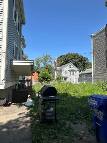 a view of a patio in backyard