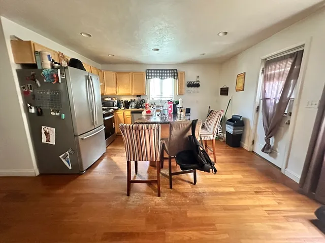 a view of a livingroom with furniture window and wooden floor