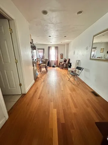 a view of a livingroom with furniture and a window