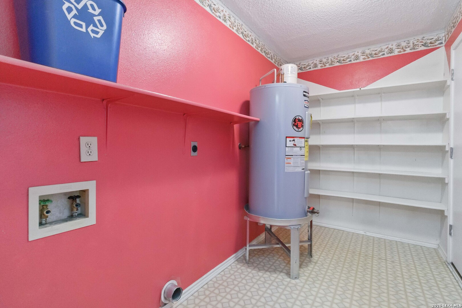 423 Rosa Verde San Antonio, TX 78207 - Photo 11 of 12 a view of a room with shelves