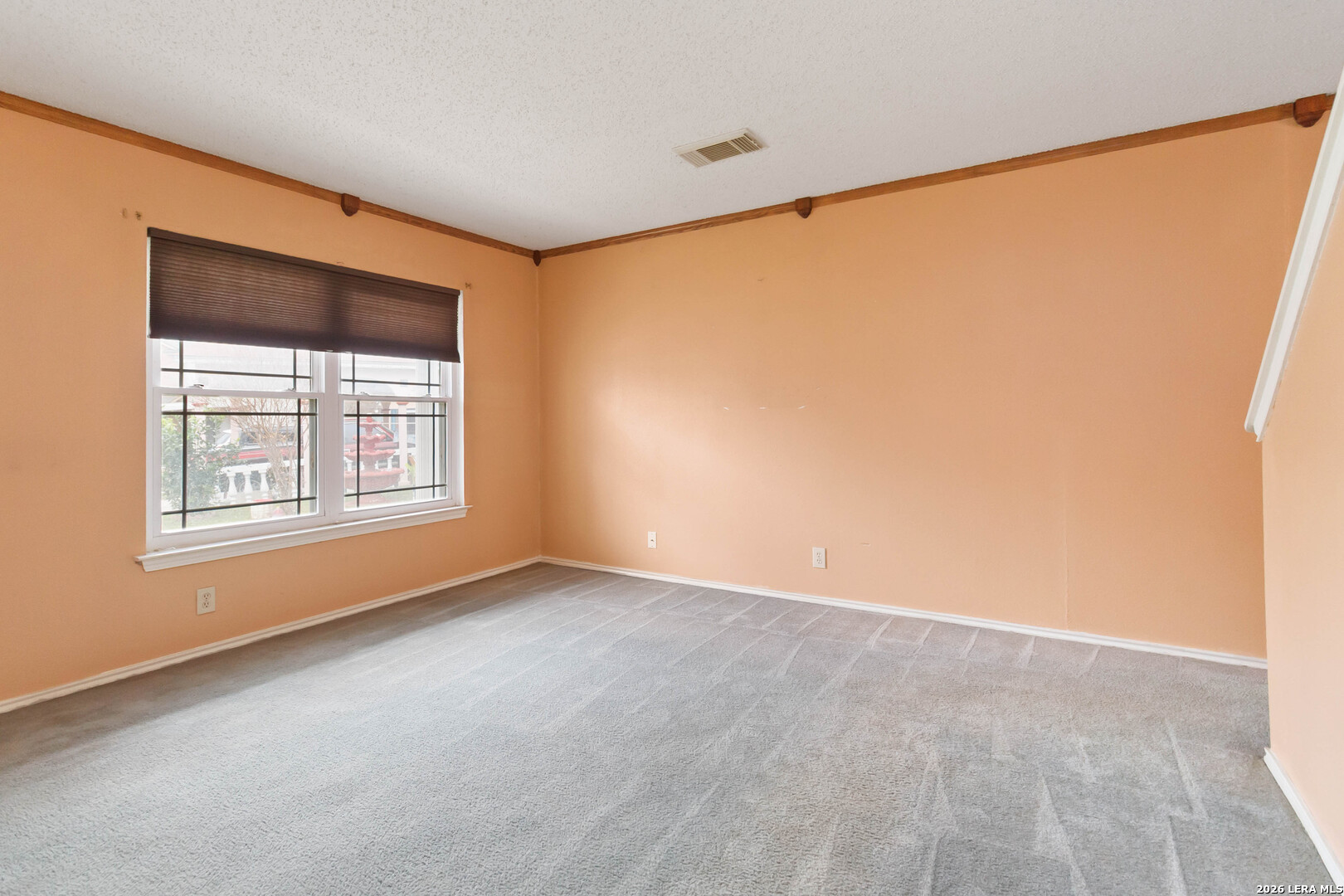 423 Rosa Verde San Antonio, TX 78207 - Photo 2 of 12 a view of an empty room with a window