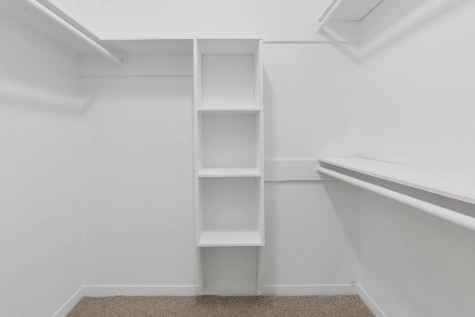 7403 Strawbridge Lane Houston, TX 77040 - Photo 14 of 22 a view of walk in closet with empty racks