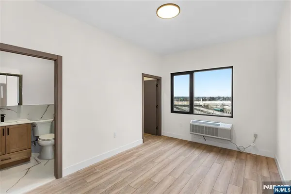 a view of a kitchen cabinets and a wooden floor