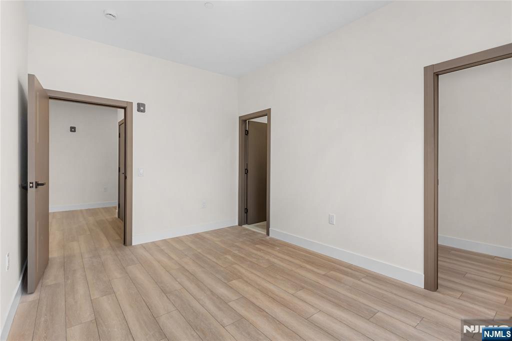 89 Mary Street, Unit 503 Paterson, NJ 07503 - Photo 8 of 14 a view of a hallway with wooden floor