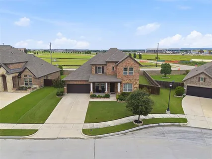 an aerial view of a house with a garden and stairs