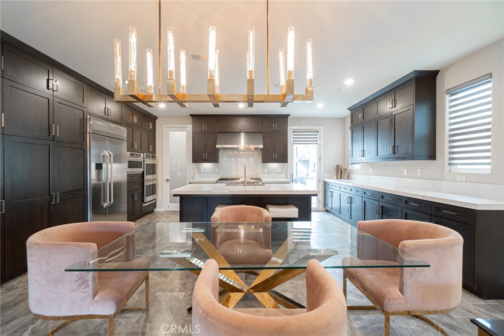 185 Tribeca Irvine, CA 92612 - Photo 15 of 55 a large kitchen with granite countertop lots of counter space