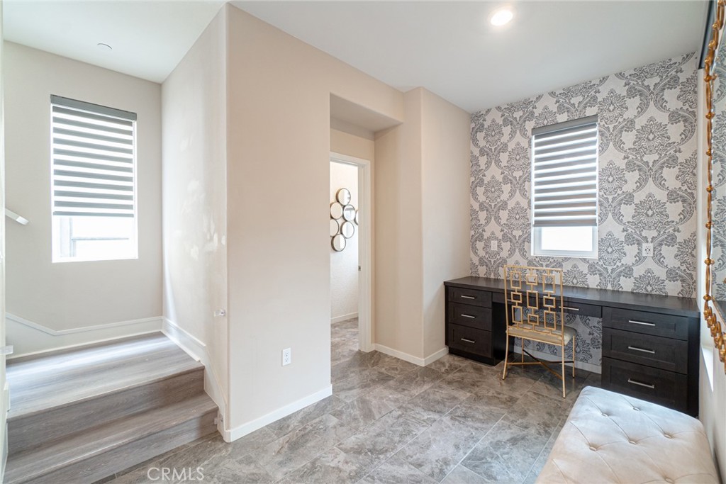 185 Tribeca Irvine, CA 92612 - Photo 16 of 55 a bedroom with a bed and a window